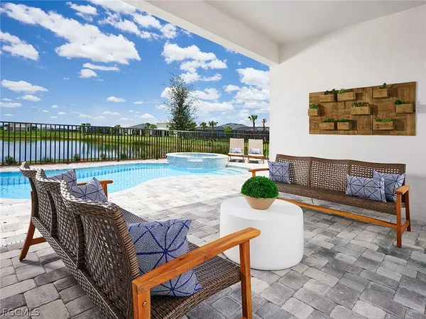 a balcony with table and chairs