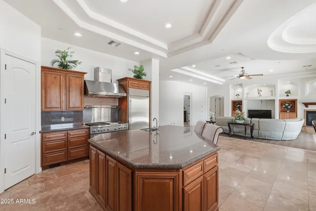 a kitchen with a stove and a refrigerator