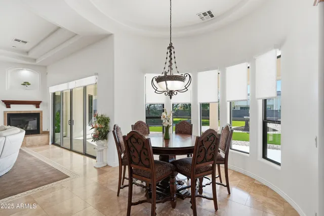 a spacious bedroom with a bed and ceiling fan