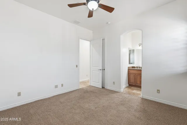 a bathroom with a granite countertop sink a mirror and a shower