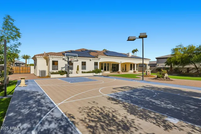 an aerial view of residential building with outdoor space and ocean view