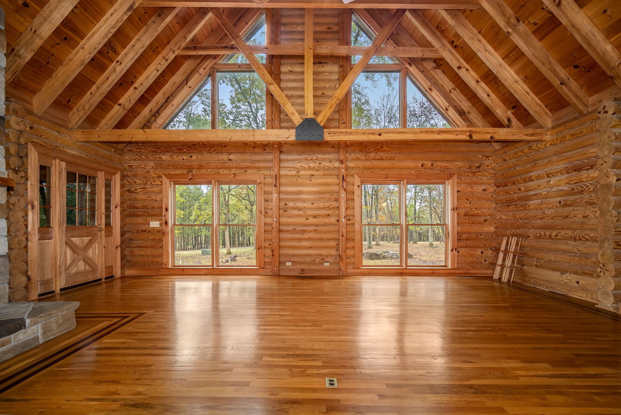 9203 Cobb Road Christiana, TN 37037 - Photo 3 of 96 a view of an empty room with wooden floor and a window