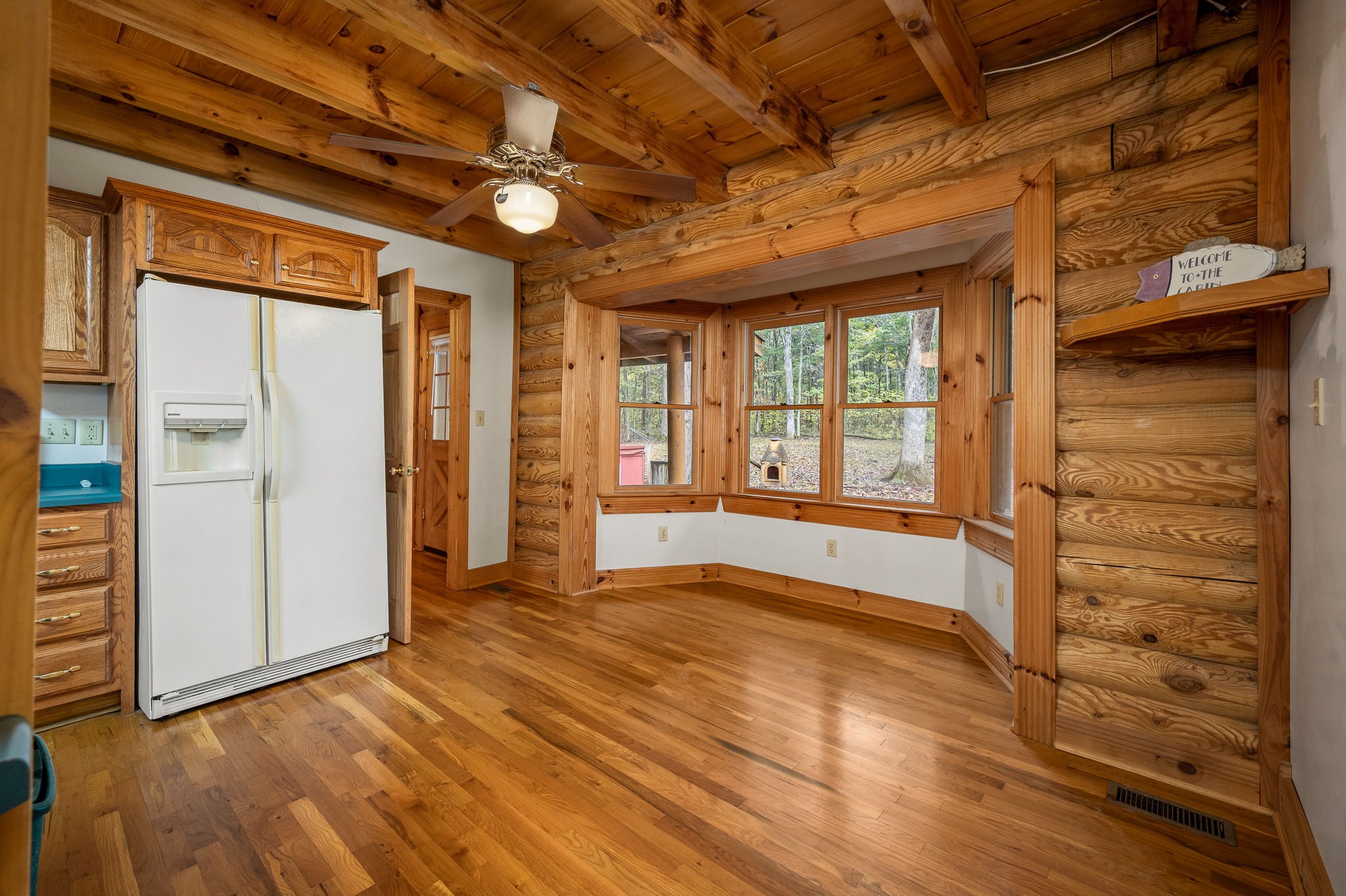 9203 Cobb Road Christiana, TN 37037 - Photo 46 of 96 a view of an empty room with wooden floor and a window