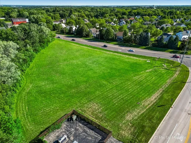 a view of yard with grass and a lake view