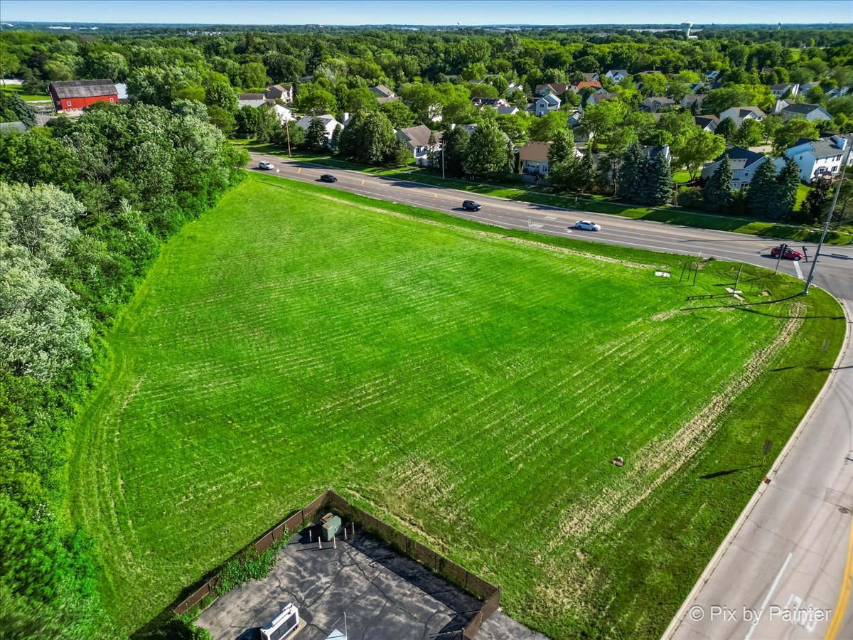 a view of yard with grass and a lake view