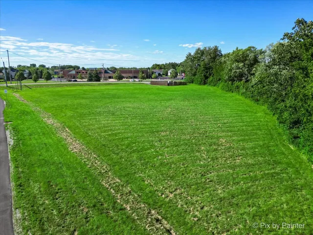 a view of a field with an trees