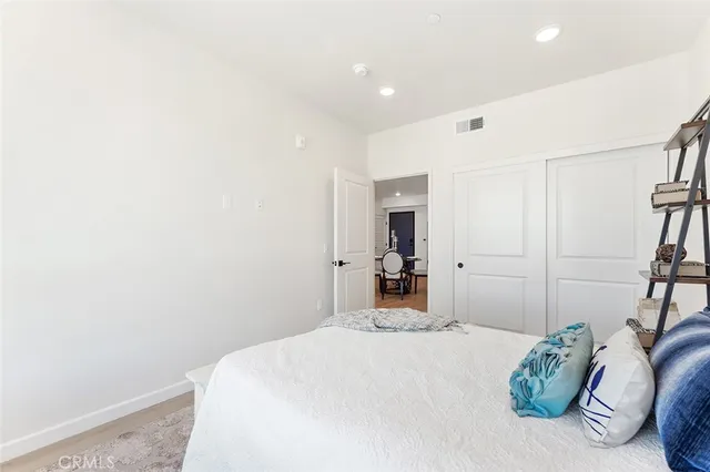 a bedroom with a bed and a couch