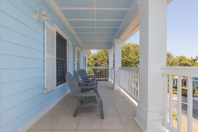 a front view of a house with a yard and a street