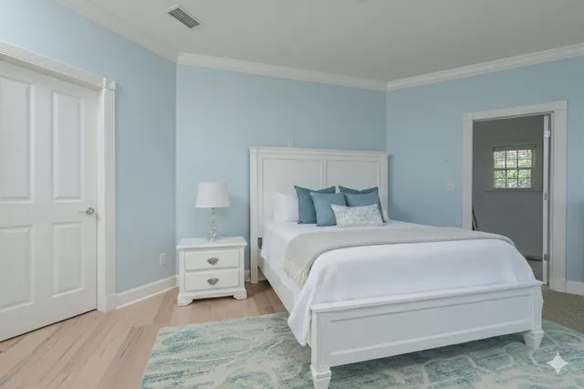 a view of a house with swimming pool lawn chairs and a yard