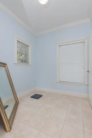 a roof deck with couch and wooden floor