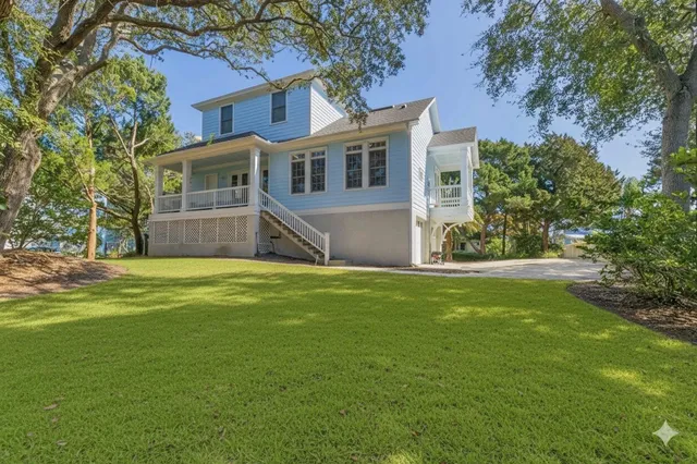 a view of a patio with table and chairs and potted plants