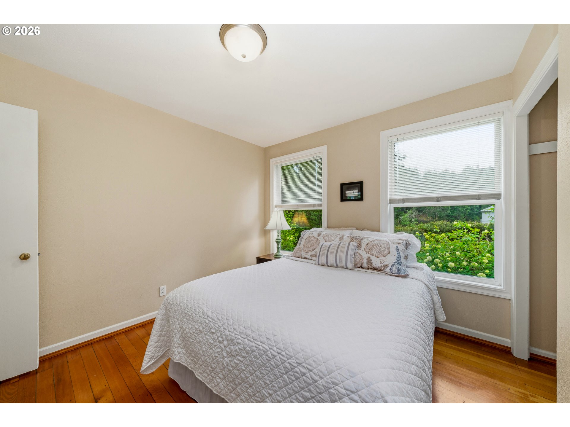 36725 North Highway 101 Nehalem, OR 97131 - Photo 19 of 40 a bedroom with a bed and a large window