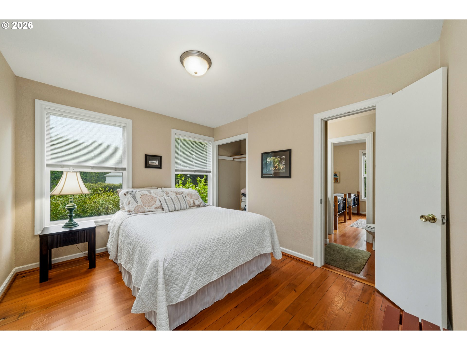 36725 North Highway 101 Nehalem, OR 97131 - Photo 20 of 40 a bedroom with a bed and a large window