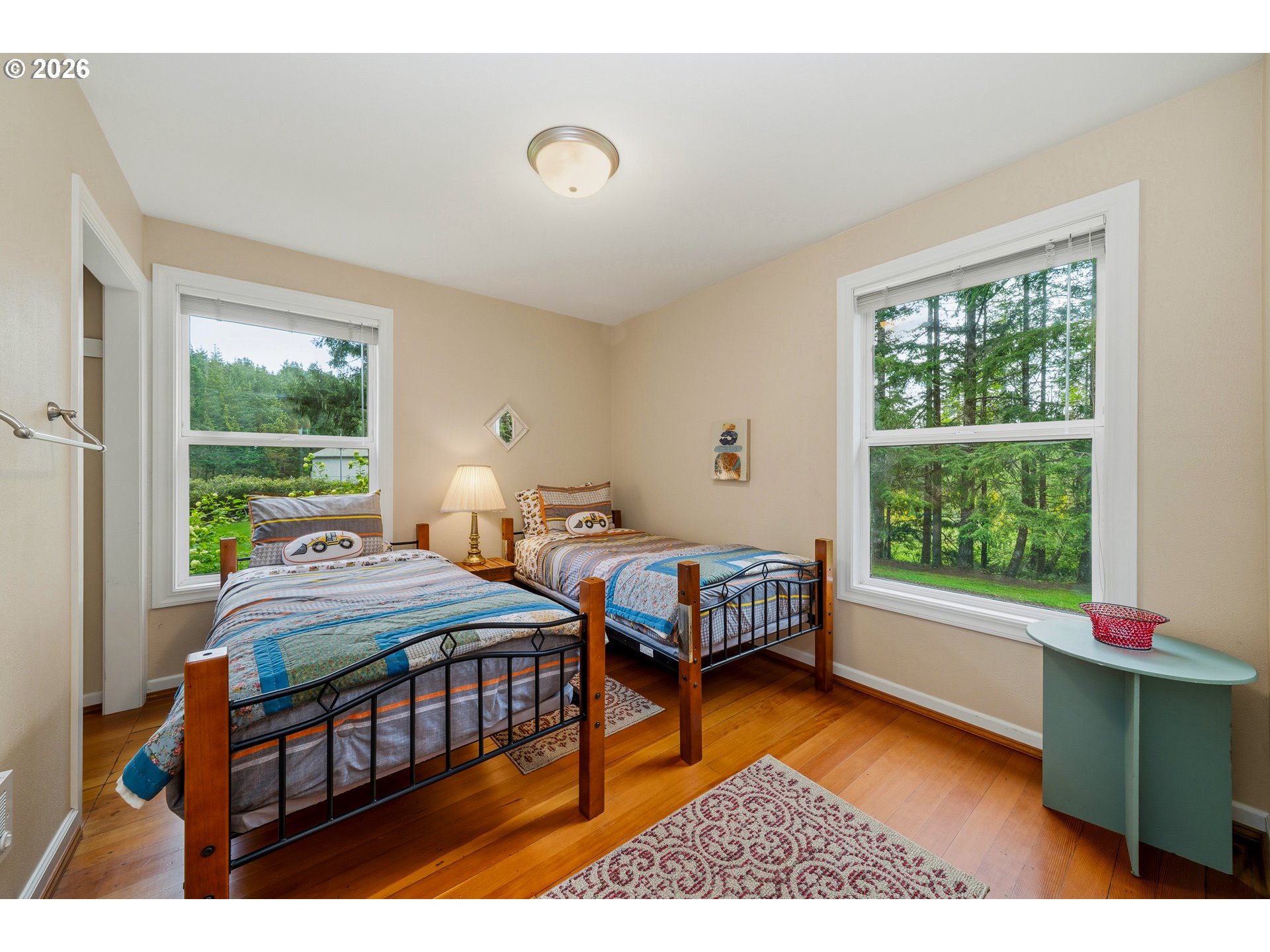 36725 North Highway 101 Nehalem, OR 97131 - Photo 21 of 40 a bedroom with a bed chair and a window