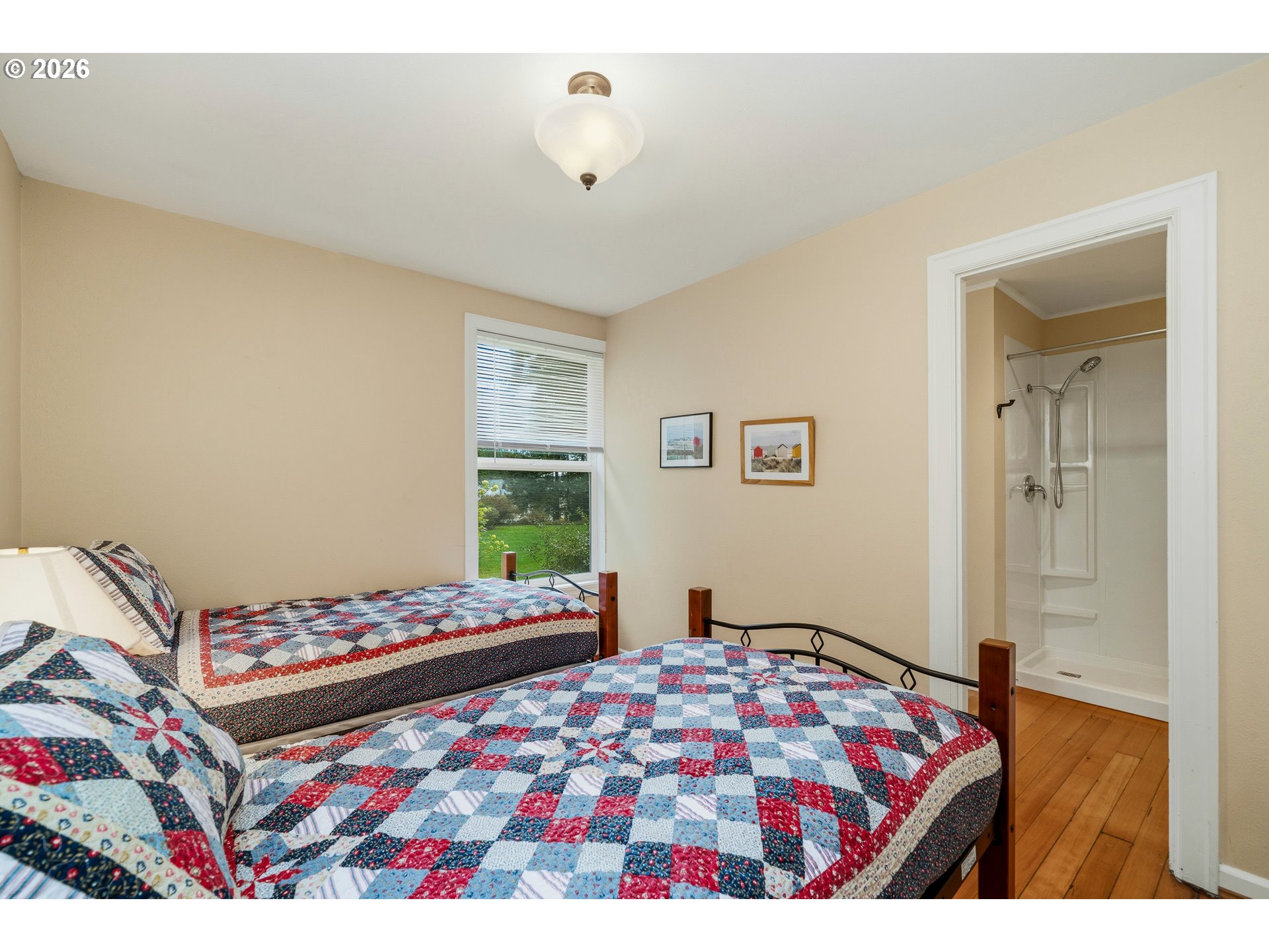 36725 North Highway 101 Nehalem, OR 97131 - Photo 23 of 40 a bedroom with a bed and a window