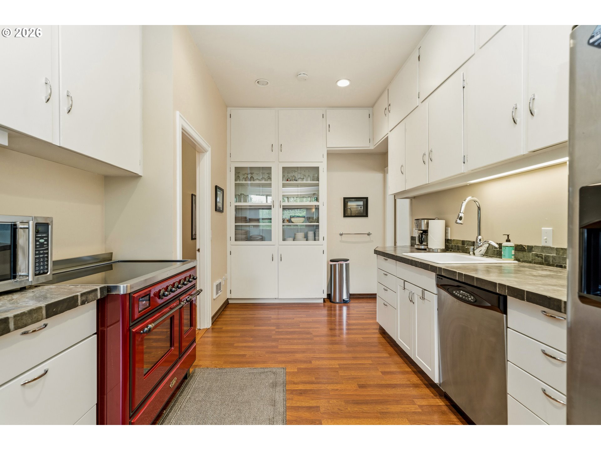 36725 North Highway 101 Nehalem, OR 97131 - Photo 10 of 40 a kitchen with stainless steel appliances granite countertop a stove a sink and a refrigerator
