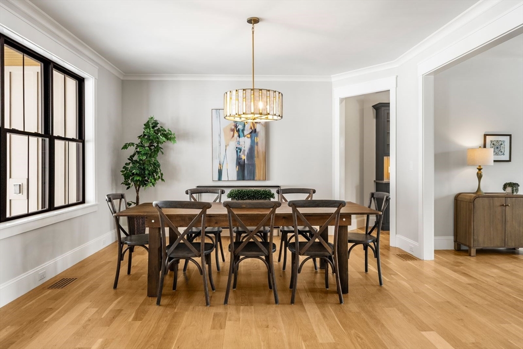 15 Whisper Way Hopkinton, MA 01748 - Photo 15 of 41 a view of a dining room with furniture window and wooden floor