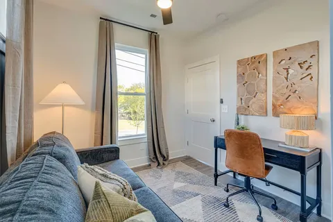 a living room with furniture and a window