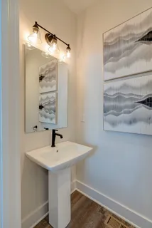 a bathroom with a sink and a mirror