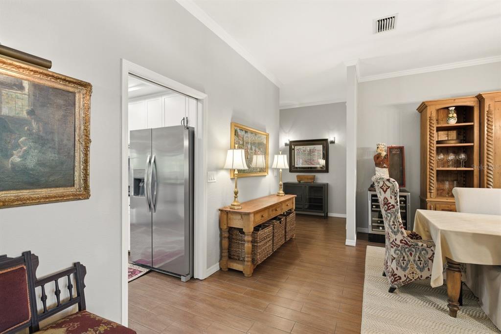 2351 Northeast Coachman Road Clearwater, FL 33765 - Photo 12 of 47 a living room with furniture and a kitchen view