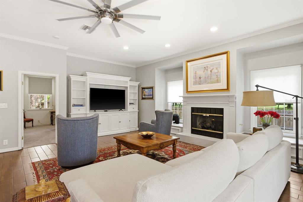 2351 Northeast Coachman Road Clearwater, FL 33765 - Photo 14 of 47 a living room with furniture and a fireplace