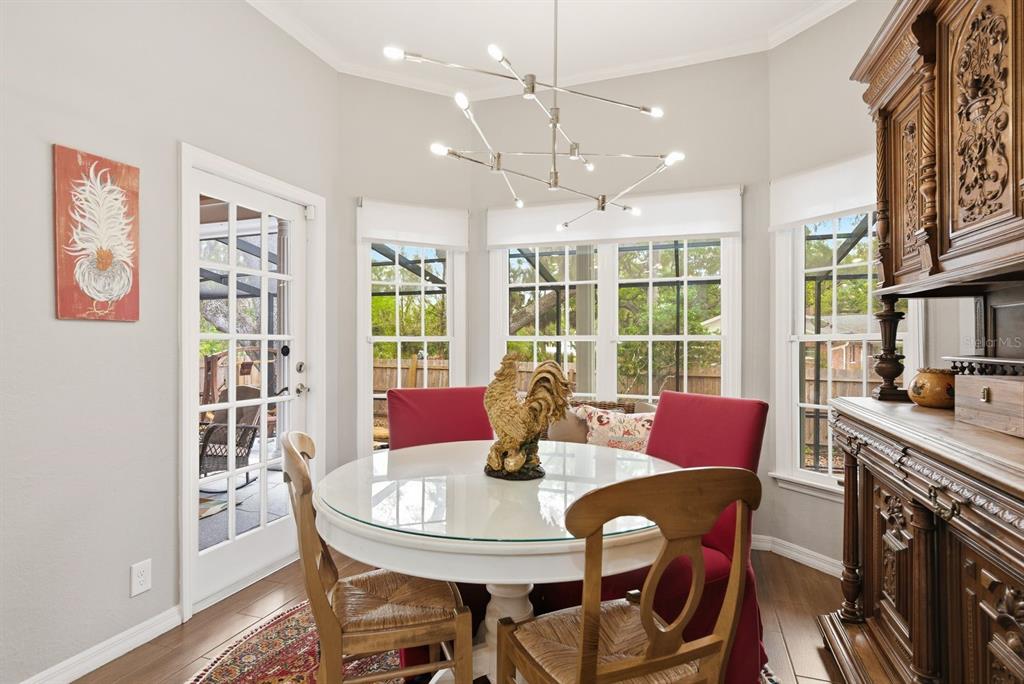 2351 Northeast Coachman Road Clearwater, FL 33765 - Photo 21 of 47 a view of a dining room with furniture window and outside view