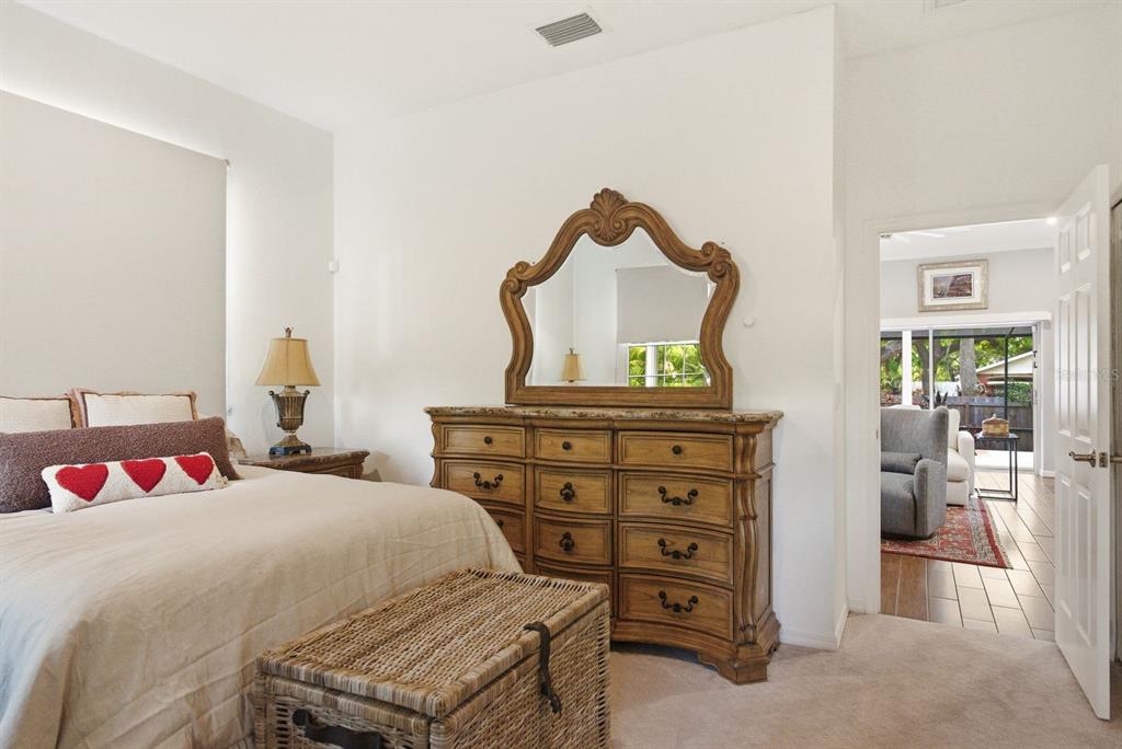 2351 Northeast Coachman Road Clearwater, FL 33765 - Photo 31 of 47 a bedroom with a bed and furniture