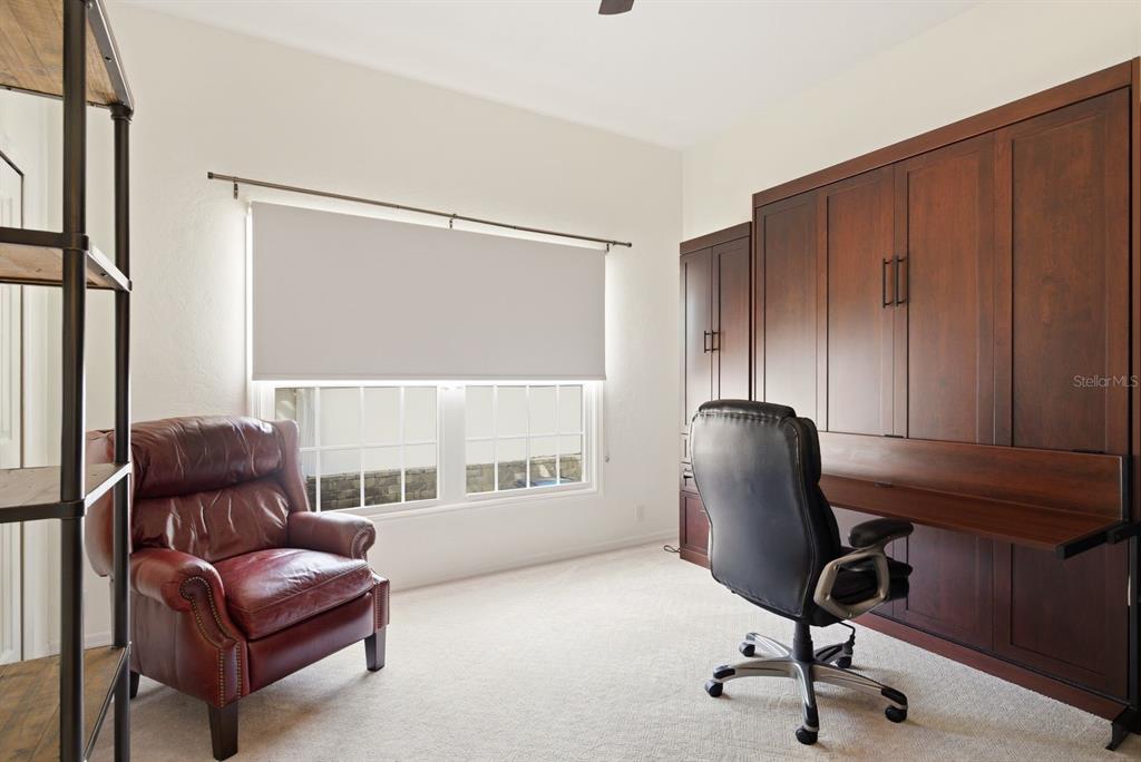 2351 Northeast Coachman Road Clearwater, FL 33765 - Photo 33 of 47 a work room with furniture and a window