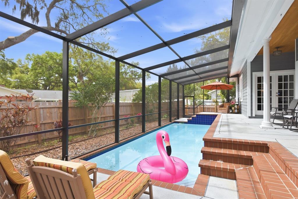 2351 Northeast Coachman Road Clearwater, FL 33765 - Photo 39 of 47 a view of swimming pool with seating space