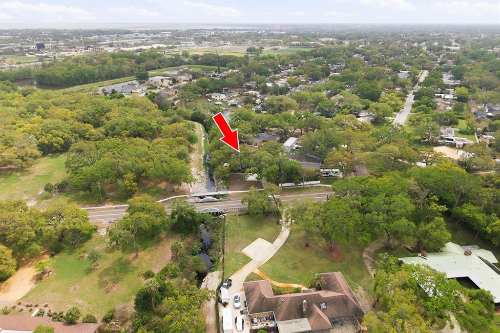 2351 Northeast Coachman Road Clearwater, FL 33765 - Photo 4 of 47 an aerial view of residential houses with outdoor space and swimming pool