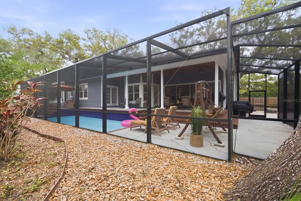 2351 Northeast Coachman Road Clearwater, FL 33765 - Photo 44 of 47 a view of a lounge chairs in the patio