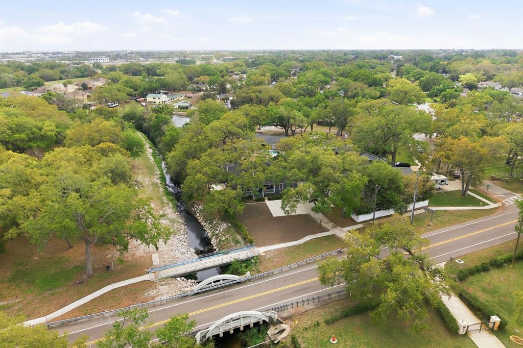 2351 Northeast Coachman Road Clearwater, FL 33765 - Photo 46 of 47 an aerial view of residential houses with outdoor space and trees