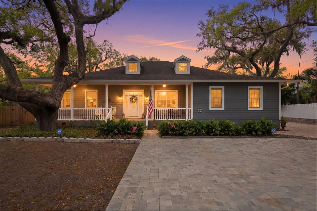 2351 Northeast Coachman Road Clearwater, FL 33765 - Photo 47 of 47 a front view of a house with a yard and a garage