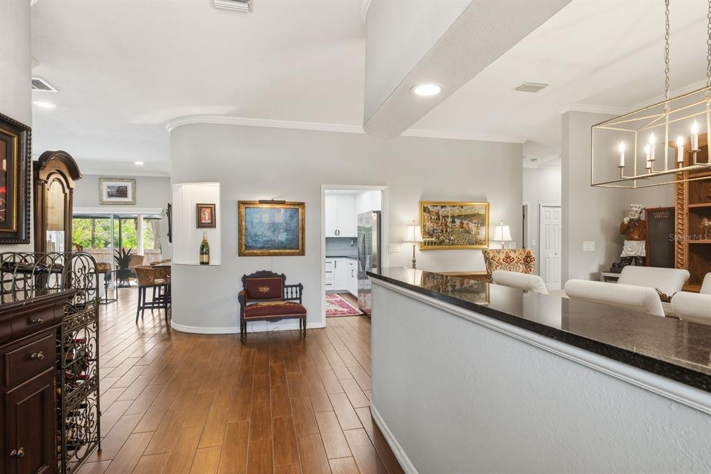 2351 Northeast Coachman Road Clearwater, FL 33765 - Photo 9 of 47 a living room with furniture and a flat screen tv