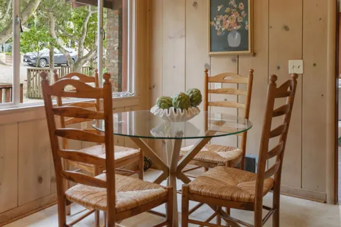 a dining room with furniture and window