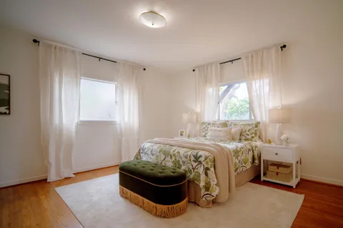 a bed room with a bed and a window