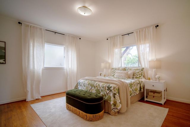 a bed room with a bed and a window