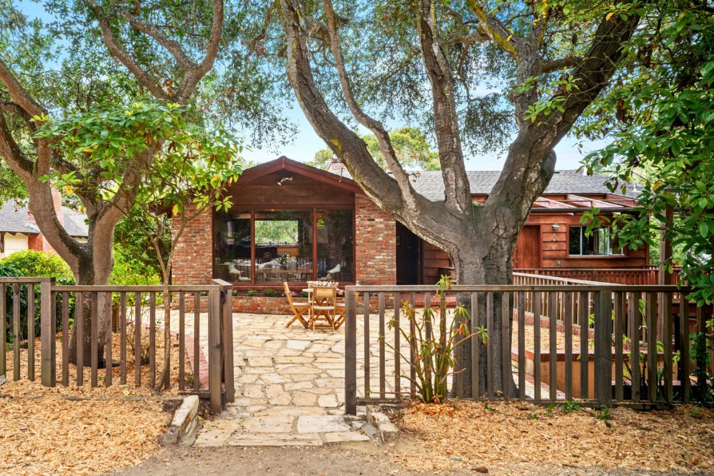 8-9 Palou Nw Of Casanova Carmel, CA 93923 - Photo 2 of 32 a front view of a house with a tree