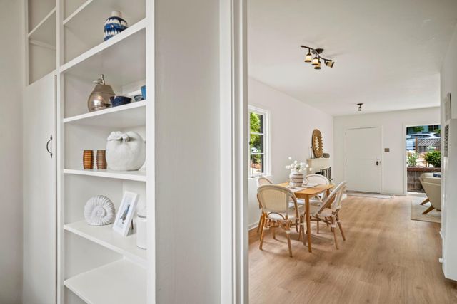 a view of kitchen and dining room with wooden floor