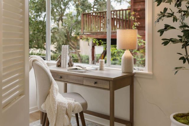 a dining room with furniture and window