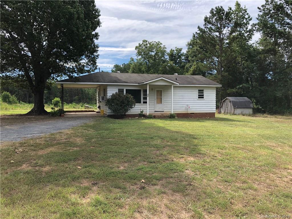 645 Crescent Road Rockwell, NC 28138 - Photo 1 of 8 a view of a house with backyard porch and sitting area