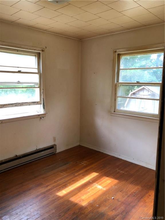 645 Crescent Road Rockwell, NC 28138 - Photo 8 of 8 a view of an empty room with wooden floor and a window