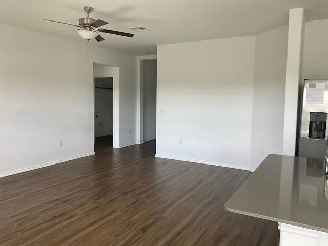 a view of a livingroom with wooden floor