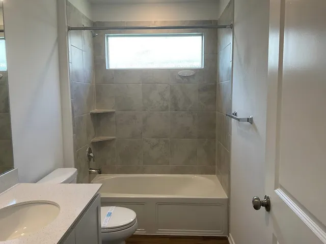 a bathroom with a sink toilet and bathtub