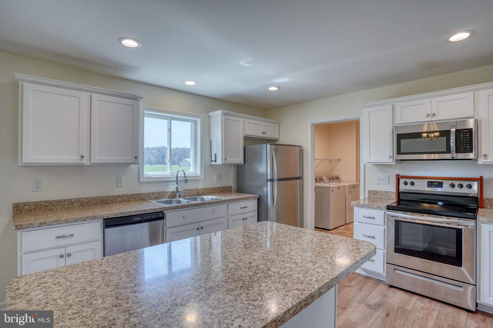 12448 Deer Forest Road Bridgeville, DE 19933 - Photo 25 of 44 Modern kitchen with sleek finishes.