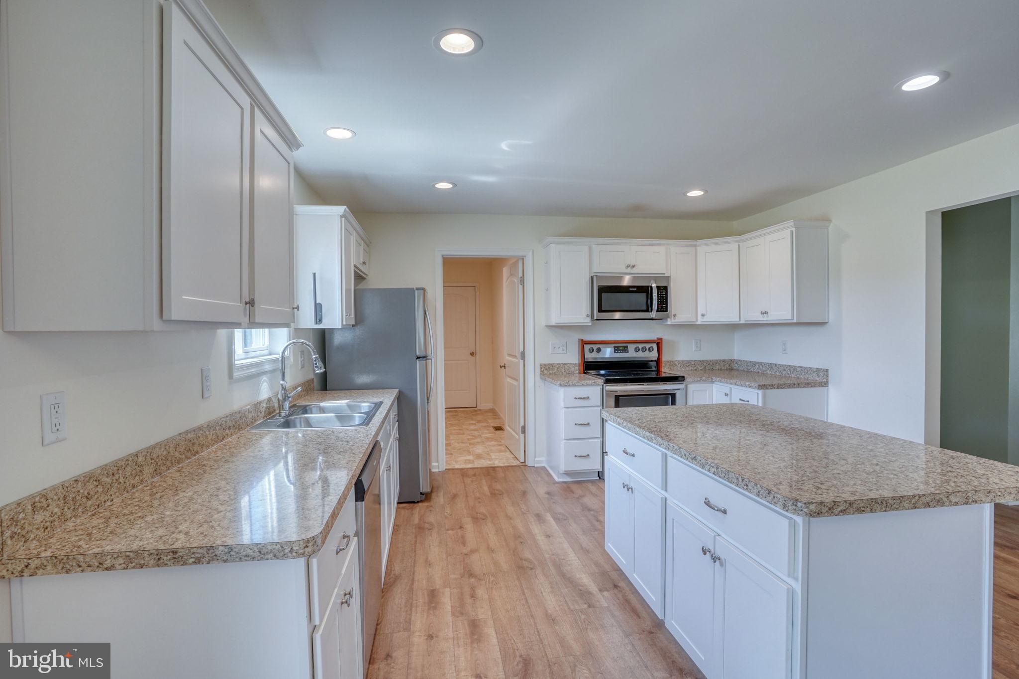12448 Deer Forest Road Bridgeville, DE 19933 - Photo 28 of 44 Modern kitchen with sleek finishes.