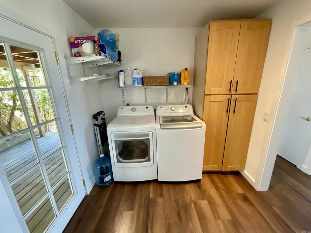 38281 Western Hills Road Anza, CA 92539 - Photo 11 of 75 a utility room with wooden floor washer and dryer