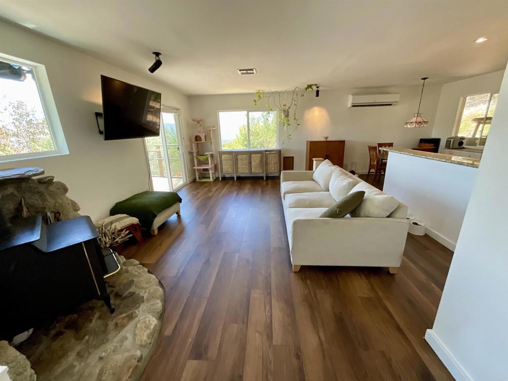 38281 Western Hills Road Anza, CA 92539 - Photo 12 of 75 a living room with furniture and a flat screen tv