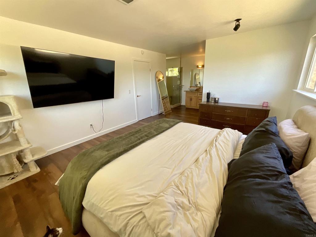 38281 Western Hills Road Anza, CA 92539 - Photo 24 of 75 a spacious bedroom with a bed and a flat screen tv