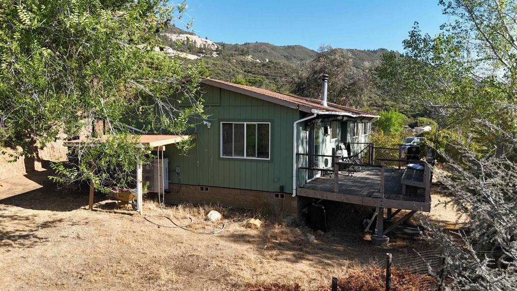 38281 Western Hills Road Anza, CA 92539 - Photo 74 of 75 a front view of a house with a yard garage and outdoor seating